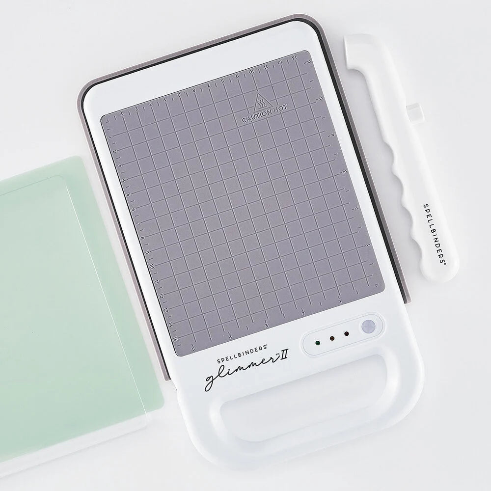 Spellbinders Glimmer II Hot Foil System mit floraler Hot Foil Platte auf der Heizplattform