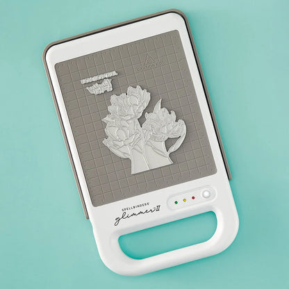 Spellbinders Glimmer II Hot Foil System mit weisser Heizplattform und magnetischem Anschluss